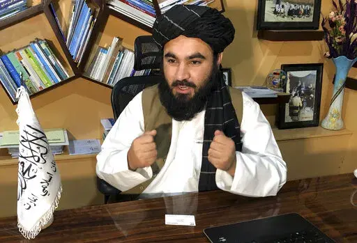 Education Ministry spokesman Mawlvi Aziz Ahmad Rayan speaks during an interview with The Associated Press in Kabul, Afghanistan, Wednesday, March 23, 2022. Afghanistan's Taliban rulers unexpectedly decided against reopening schools Wednesday to girls above the sixth grade, reneging on a promise and opting to appease their hard-line base at the expense of further alienating the international community. (AP Photo/Mohammed Shoaib Amin)