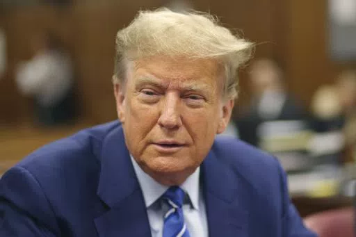 Former President Donald Trump awaits the start of proceedings on the second day of jury selection at Manhattan criminal court, Tuesday, April 16, 2024, in New York. Trump returned to the courtroom Tuesday as a judge works to find a panel of jurors who will decide whether the former president is guilty of criminal charges alleging he falsified business records to cover up a sex scandal during the 2016 campaign. (Michael M. Santiago/Pool Photo via AP)