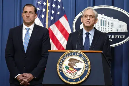 Attorney General Merrick Garland speaks during a news conference at the Department of Justice, Thursday, Jan. 12, 2023, in Washington, as John Lausch, the U.S. Attorney in Chicago, looks on. Robert Hur, the former Trump-appointed U.S. attorney in Maryland, will lead the investigation, taking over from the top Justice Department prosecutor in Chicago, John Lausch, who was earlier assigned by the department to investigate the matter and who recommended to Garland last week that a special counsel b