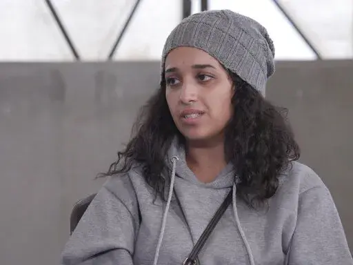 In this image taken from video Hoda Muthana talks during an interview in Roj detention camp in Syria where she is being held by U.S.-allied Kurdish forces, Wednesday, Nov. 9, 2022. Muthana, who ran away from home in Alabama at the age of 20, joined the Islamic State group and had a child with one of its fighters says she still hopes to return to the United States, serve prison time if necessary, and advocate against the extremists. (AP Photo/The News Movement)