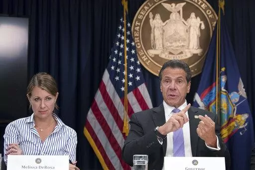 Secretary to the Governor Melissa DeRosa, left, joins New York Gov. Andrew Cuomo as he speaks to reporters during a news conference on Sept. 14, 2018, in New York. A New York state trooper who testified that former Gov. Andrew Cuomo sexually harassed her filed a lawsuit Thursday, Feb. 17, 2022, and asked a federal court to declare that Cuomo, a top aide and state police violated her civil rights. The trooper, whose name was not disclosed in the lawsuit, filed the suit in Manhattan against Cuomo,