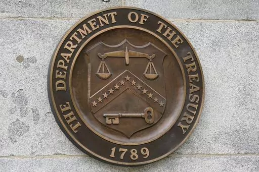 The Department of the Treasury's seal outside the Treasury Department building in Washington on May 4, 2021. The United States has slapped more sanctions on people and firms associated with Iran and with what it calls an illicit banking network used to conceal transactions. The U.S. said Thursday it placed the penalties on 39 firms linked to a shadow banking system that helped to muddy financial activity between sanctioned Iranian firms and foreign buyers, namely for petrochemicals. (AP Photo/Pa
