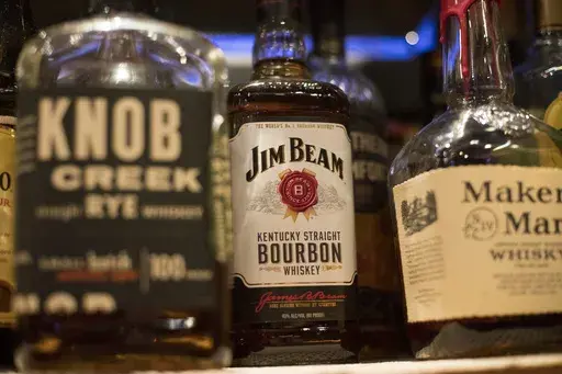 Jim Beam, Knob Creek and other alcohol bottles are pictured at a bar in Eagle, Colo., Dec. 25, 2018. (AP Photo/Jenny Kane, File)