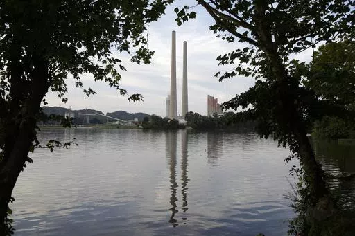 In this Aug. 7, 2019, photo, the Kingston Fossil Plant stands near a waterway in Kingston, Tenn. The nation’s largest public utility is moving ahead with a plan for a new natural gas plant in Tennessee despite warnings that its environmental review of the project doesn’t comply with federal law. The Environmental Protection Agency asked the Tennessee Valley Authority in a March 25, 2024 letter to redo several aspects of its environmental impact statement for converting the coal-burning Kings