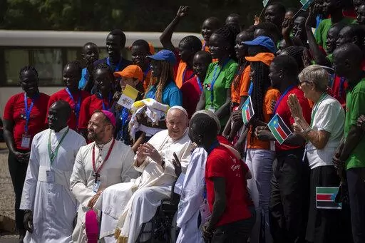 Pope Francis meets with a group of the Catholic faithful from the town of Rumbek, who had walked for more than a week to reach the capital, after he addressed clergy at the St. Theresa Cathedral in Juba, South Sudan Saturday, Feb. 4, 2023. Pope Francis is in South Sudan on the second leg of a six-day trip that started in Congo, hoping to bring comfort and encouragement to two countries that have been riven by poverty, conflicts and what he calls a "colonialist mentality" that has exploited Afric