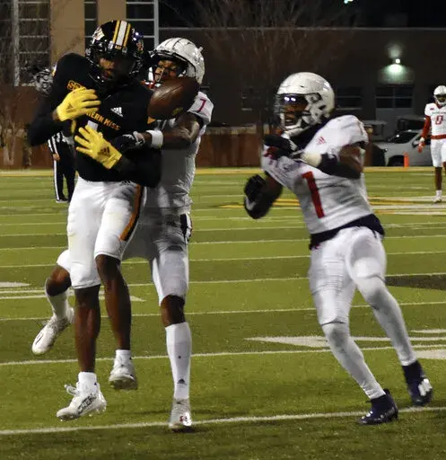 Southern Mississippi wide receiver Jason Brownlee drops a pass against South Alabama in the fourth quarter of an NCAA college football game in Hattiesburg, Miss., Saturday, Nov. 19, 2022. (Aimee Cronan/The Gazebo Gazette via AP)