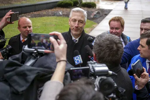 Michael Hills, the defense attorney representing Brandon Caserta, speaks to a scrum of reporters after Casterta was found not guilty of conspiring to kidnap and weapons charges outside the Gerald R. Ford Federal Building and Courthouse in Grand Rapids, Mich., Friday, April 8, 2022. Jurors have acquitted two defendants, Daniel Harris and Caserta, of all charges in a plot to kidnap Michigan Gov. Gretchen Whitmer but couldn't agree on a verdict for two others. (Daniel Shular/MLive.com/The Grand Rap