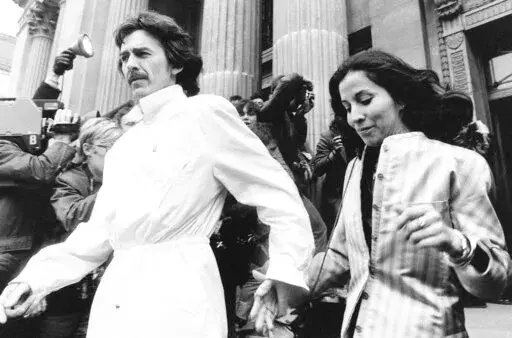 FILE -Former Beatle George Harrison and his wife Olivia leave the Marylebone Register office in London after attending the wedding of former Beatle drummer Ringo Starr April 27, 1981. Harrison's widow Olivia will release a collection of 20 original poems about her husband for the book “Came the Lightening,” which comes out June 21, it was announced Thursday, April 21, 2022. (AP Photo/File
