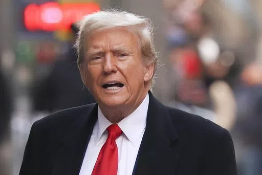 Former President Donald Trump comments as he arrives for a press conference, March 25, 2024, in New York. Trump is set to stand trial Monday, April 15, in New York on state charges related to the very sex scandal that he and his aides strove to hide. Barring a last-minute delay, it will be the first of Trump's four criminal cases to go to trial. (AP Photo/Yuki Iwamura, File)