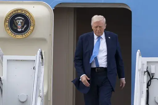 President Donald Trump arrives on Air Force One at Palm Beach International Airport, Friday, March 28, 2025, in West Palm Beach, Fla. (AP Photo/Manuel Balce Ceneta)