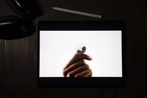 In this illustration photographed in La Habra, Calif., the AirTag tracking device is introduced during a virtual event held to announce new Apple products, Tuesday, April 20, 2021. On Friday, March 15, 2024, U.S. judge has denied Apple's motion to dismiss a class-action lawsuit claiming that stalkers are using AirTag devices to track victims — and that the tech giant hasn't done enough to prevent it. (AP Photo/Jae C. Hong, File)