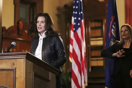 Michigan Office of the Governor, Michigan Gov. Gretchen Whitmer addresses the state during a speech in Lansing, Mich. on Oct. 8, 2020. Jurors on Friday, April 7, 2022, acquitted two men and deadlocked on two others accused of plotting to abduct Whitmer in 2020. (Michigan Office of the Governor via AP, File)
