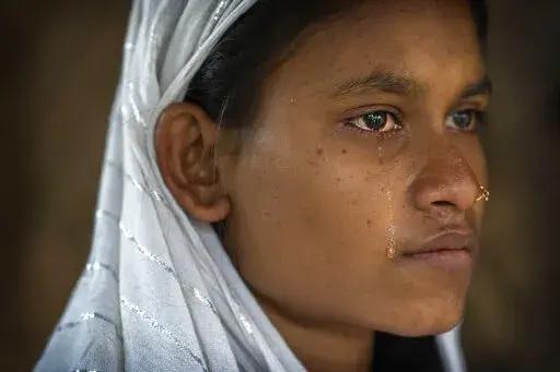 Nureja Khatun, 19, cries as she waits in her shanty home for her husband Akbor Ali to return, in Morigaon district of Indian northeastern state of Assam, Saturday, Feb. 11, 2023. Khatun's husband is one among more than 3,000 men, including Hindu and Muslim priests, who were arrested nearly two weeks ago in the northeastern state of Assam under a wide crackdown on illegal child marriages involving girls under the age of 18. (AP Photo/Anupam Nath)