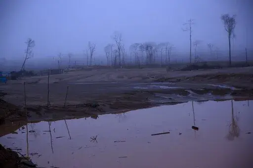 This Wednesday, Feb. 24, 2016 photo shows the deforestation of what was once pristine rainforest, caused by gold mining, during a government raid on illegal wildcat mining operations in La Pampa, in Peru's Madre de Dios region. The Monitoring of the Andean Amazon Project, an initiative of the nonprofit Amazon Conservation Association, reported on Thursday, June 2, 2022, that deforestation in the Peruvian Amazon has hit six historical highs in the past ten years.  (AP Photo/Rodrigo Abd, FIle)