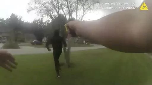 In this image taken from Jacksonville (Florida) Sheriff's Office body camera video, suspect Le'Keian Woods is hit with a Taser stun gun as he is chased by a Jacksonville police officer after fleeing a vehicle that was stopped during a traffic stop Friday, Sept. 29, 2023, in Fla. A Florida sheriff released the body camera video Monday, Oct. 2, that he says shows his officers were justified when they repeatedly punched, elbowed and kneed Woods, a drug suspect, who gave chase after being pulled ove