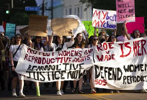 A large crowd marches on Cedar Avenue to downtown during a University of Minnesota student led protest in Minneapolis, Minn., after the Supreme Court overruled Roe v Wade on Friday, June 24, 2022. A judge declared many of Minnesota's restrictions on abortion unconstitutional on Monday, June 11, 2022, including the state's mandatory 24-hour waiting period and a requirement that both parents be notified before a minor can get an abortion. (Renée Jones Schneider/Star Tribune via AP)