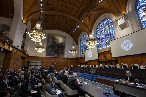Judges are seated as the International Court of Justice in The Hague, Netherlands, opens hearings into what countries worldwide are legally required to do to combat climate change and help vulnerable nations fight its devastating impact, Monday, Dec. 2, 2024. (AP Photo/Peter Dejong)