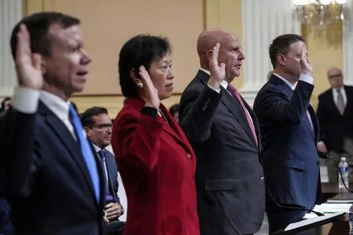 From left are Scott Paul, president of the Alliance for American Manufacturing, Tong Yi, a human rights activist, H.R. McMaster, a former national security adviser to President Donald Trump, and Matthew Pottinger, a former deputy national security adviser to President Donald Trump, are sworn in as a special House committee dedicated to countering China holds a hearing at the Capitol in Washington, Tuesday, Feb. 28, 2023. (AP Photo/J. Scott Applewhite)