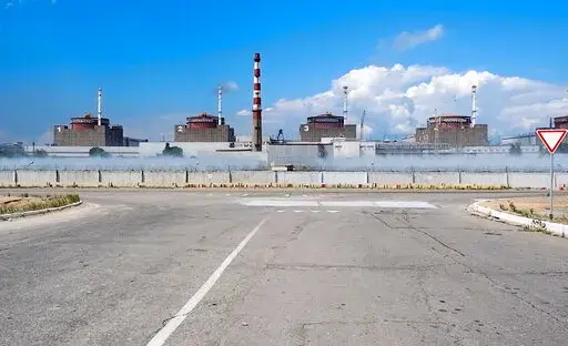 This handout photo taken from video and released by Russian Defense Ministry Press Service on Aug. 7, 2022, shows a general view of the Zaporizhzhia Nuclear Power Station in territory under Russian military control, southeastern Ukraine. Ukraine’s nuclear power provider says Russian forces blindfolded and detained the head of Europe’s largest nuclear power plant hours after Moscow illegally annexed a swath of Ukrainian territory. In a possible attempt to secure Moscow’s hold on the newly a