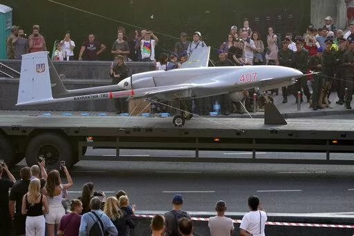A Turkish-made Bayraktar TB2 drone is displayed during a rehearsal of a military parade dedicated to Independence Day in Kyiv, Ukraine, Aug. 20, 2021. The drones, which carry lightweight, laser-guided bombs, have carried out unexpectedly successful attacks in the early stages of Ukraine's conflict with Russia. (AP Photo/Efrem Lukatsky, File)