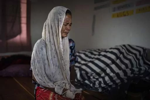 Kim Neineng, 43, a tribal Kuki, cries as she narrates the killing of her husband, at a relief camp in Churachandpur, in the northeastern Indian state of Manipur, Tuesday, June 20, 2023. Neineng escaped with her four children to a nearby relief camp when a Meitei mob descended on their village. Her husband was killed by the mob — beaten with iron bars, his legs chopped off and then picked and tossed in the raging fire that had already engulfed his home. The deadly conflict between the two ethni