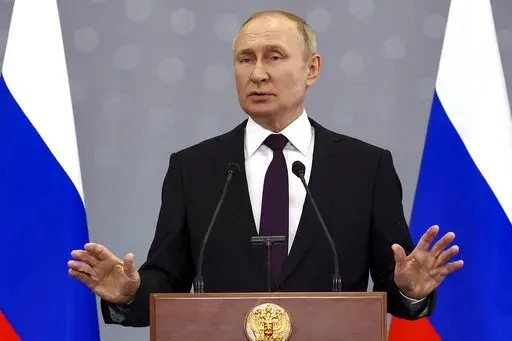 Russian President Vladimir Putin gestures as he speaks to the media after the Summit of leaders from the Commonwealth of Independent States (CIS), in Astana, Kazakhstan, Friday, Oct. 14, 2022. (Valery Sharifulin, Sputnik, Kremlin Pool Photo via AP)