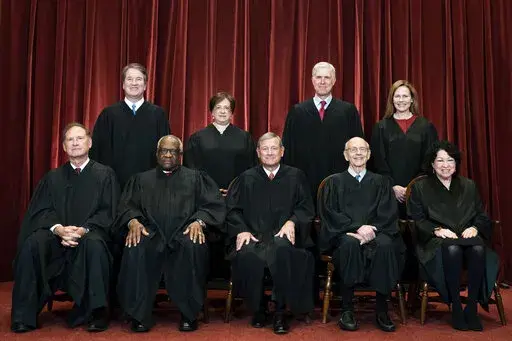 Members of the Supreme Court pose for a group photo at the Supreme Court in Washington, April 23, 2021. Seated from left are Associate Justice Samuel Alito, Associate Justice Clarence Thomas, Chief Justice John Roberts, Associate Justice Stephen Breyer and Associate Justice Sonia Sotomayor, Standing from left are Associate Justice Brett Kavanaugh, Associate Justice Elena Kagan, Associate Justice Neil Gorsuch and Associate Justice Amy Coney Barrett. (Erin Schaff/The New York Times via AP, Pool)