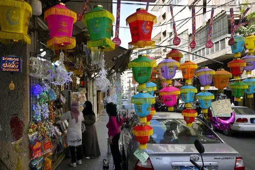 People shop for decorations for the Muslim holy month of Ramadan in Beirut, Lebanon, Saturday, April 2, 2022. Muslims throughout the world are marking Ramadan, a month of fasting during which observants abstain from food, drink and other pleasures from sunrise to sunset. (AP Photo/Bilal Hussein, File)