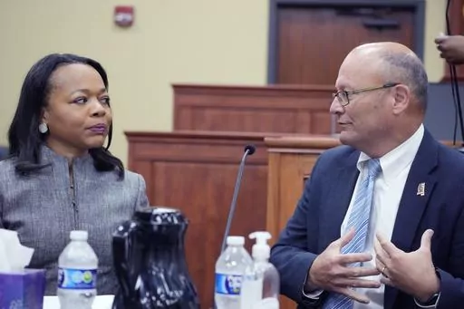 U.S. Assistant Attorney General Kristen Clarke of the Justice Department's Civil Rights Division, left, confers with U.S. Attorney Darren J. LaMarca for the Southern District of Mississippi, prior to addressing community leaders in Lexington, Miss., during a stop on the division's civil rights tour, Thursday, June 1, 2023. At each of the four stops in Mississippi, Clarke plans to engage with community leaders and reaffirm the department's commitment to protecting the civil rights of all American