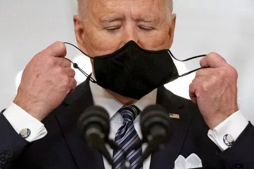 President Joe Biden takes off his mask to speak about the COVID-19 pandemic during a prime-time address from the East Room of the White House, on March 11, 2021, in Washington. (AP Photo/Andrew Harnik, File)