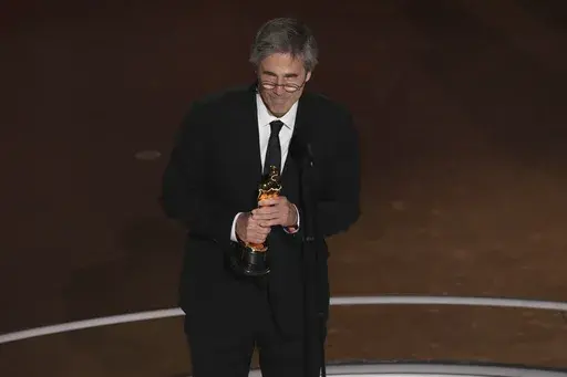 Walter Salles accepts the award for "I'm Still Here" from Brazil, for best international feature film during the Oscars on Sunday, March 2, 2025, at the Dolby Theatre in Los Angeles. (AP Photo/Chris Pizzello)