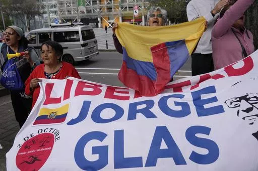 Supporters of former Vice President Jorge Glas cheer after an Ecuadorian court of justice declared that his arrest inside Mexico's embassy was illegal, in Quito, Ecuador, April 12, 2024. Ecuador announced on Monday, April 29, that it is suing Mexico before the International Court of Justice for granting political asylum to Glas who was later imprisoned after a break-in at the country's embassy in Quito, triggering the rupture of diplomatic relations between Ecuador and Mexico. (AP Photo/Dolores 