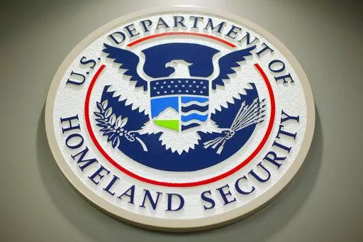 The Department of Homeland Security logo is seen during a news conference in Washington, Feb. 25, 2015. DHS says a looming Supreme Court decision on abortion, an increase of migrants at the U.S.-Mexico border and the midterm elections are potential triggers for extremist violence over the next six months. DHS said June 7, 2022, in the National Terrorism Advisory System bulletin the U.S. was in a "heightened threat environment" already and these factors may worsen the situation. (AP Photo/Pablo M