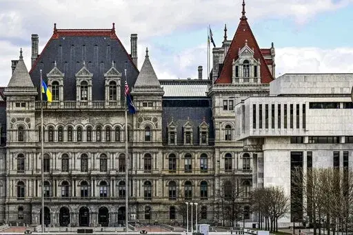 A partial views of the New York state Capitol building, left, is shown next to the state Appellate court building in foreground, right, Monday, April 4, 2022, in Albany, N.Y. A panel of five mid-level New York appellate judges have ruled on Thursday, April 21, 2022 that state Democrats engaged in gerrymandering when drawing new congressional district boundaries for the next decade. (AP Photo/Hans Pennink, File)