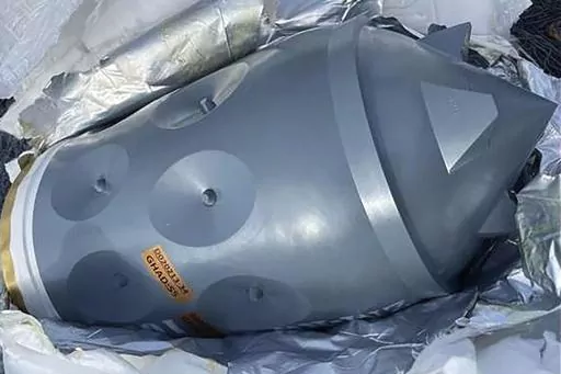 This image released by the U.S. Department of Justice in an FBI affidavit filed in U.S. District Court, Alexandria, Va., shows what is described as an Iranian-made warhead bound for Yemen's Houthi, seized off a vessel in the Arabian Sea. Four foreign nationals were charged Thursday, Feb. 22, 2024, with transporting suspected Iranian-made weapons on a vessel intercepted by U.S. naval forces in the Arabian Sea the previous month. Two Navy SEALs died during the mission. (U.S. Department of Justice 