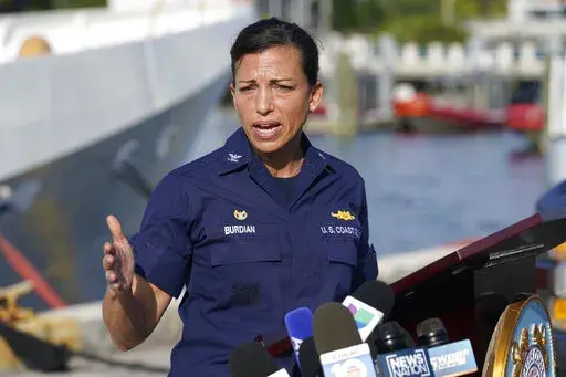 U.S. Coast Guard Captain Jo-Ann F. Burdian details the search of 38 missing migrants at a news conference, Wednesday, Jan. 26, 2022, in Miami Beach, Fla. One migrant was found clinging to the hull of an overturn vessel and one body was recovered off the coast of Fort Pierce, Fla. The migrants left the Bahamas on Saturday in what the Coast Guard suspects is a human smuggling operation. (AP Photo/Marta Lavandier)