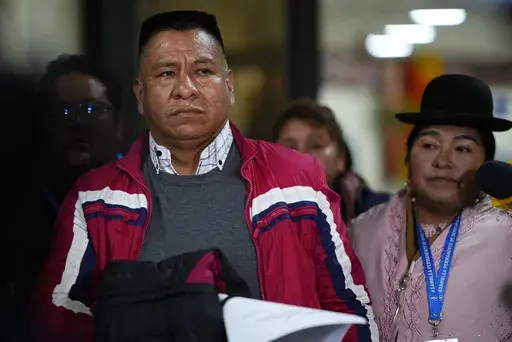Former Jesuit Pedro Lima stops to talk to journalists after landing at El Alto international airport in El Alto, Bolivia, Monday, May 22, 2023, before traveling to the capital La Paz to make a statement at the public prosecutors office related to a church pedophilia scandal. Lima denounced pedophilia by the late Spanish Jesuit Priest, Alfonso Pedrajas, and was expelled from the Society of Jesus in 2001. (AP Photo/Juan Karita)