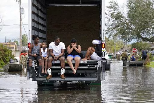 People are evacuated from floodwaters in the aftermath of Hurricane Ida in LaPlace, La., Monday, Aug. 30, 2021. (AP Photo/Gerald Herbert)