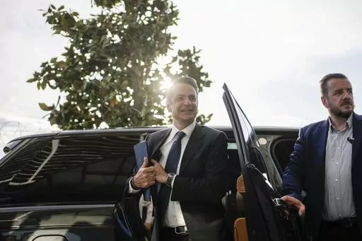 Greece's Prime Minister and New Democracy leader Kyriakos Mitsotakis arrives for an interview at Alpha television station during his election campaign in Athens, Greece, Tuesday, April 25, 2023. (AP Photo/Thanassis Stavrakis)