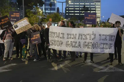 People take part in a protest demanding the immediate release of hostages held by Hamas in the Gaza Strip, in Tel Aviv, Israel, Saturday, April 5,2025. (AP Photo/Ariel Schalit)