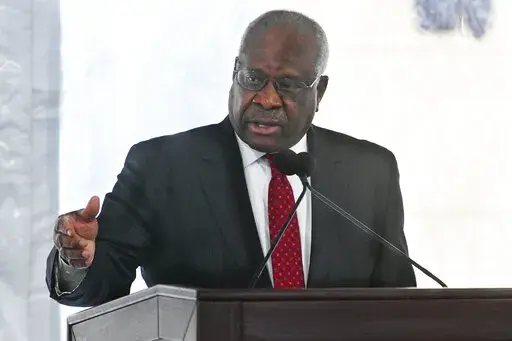 Supreme Court Justice Clarence Thomas delivers a keynote speech during a dedication of Georgia new Nathan Deal Judicial Center in Atlanta, Feb. 11, 2020. Reports that the wife of Thomas implored Donald Trump’s White House chief of staff to act to overturn the 2020 election results has put a spotlight on how justices decide whether to step aside from a case. (AP Photo/John Amis, File)