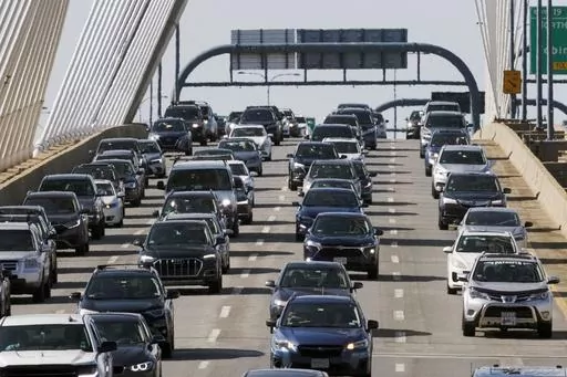 Heavy traffic heads south on Interstate 93 over the Zakim Bridge, Sept. 1, 2023, in Boston. Crash and fatality rates among drivers under 21 have fallen dramatically during the past 20 years, according to a new report made public Wednesday, Oct. 18, while noting young drivers are still by far the riskiest group behind the wheel. (AP Photo/Michael Dwyer, File)