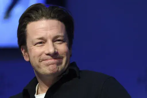 British chef Jamie Oliver attends a panel session during the 47th annual meeting of the World Economic Forum, WEF, in Davos, Switzerland, Jan. 18, 2017. (Laurent Gillieron/Keystone via AP, file)