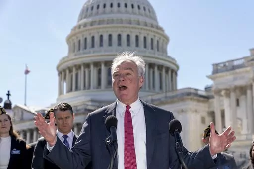 Sen. Tim Kaine, D-Va., center, and Sen. Todd Young, R-Ind., center left, are joined by representatives of the American Legion as they speak to reporters about ending the authorization for use of military force enacted after the Sept. 11, 2001, terrorist attacks, at the Capitol in Washington, Thursday, March 16, 2023. Senators voted 68-27 Thursday to move forward with a bill to repeal the 2002 measure that authorized the March 2003 invasion of Iraq and a 1991 measure that sanctioned the U.S.-led 