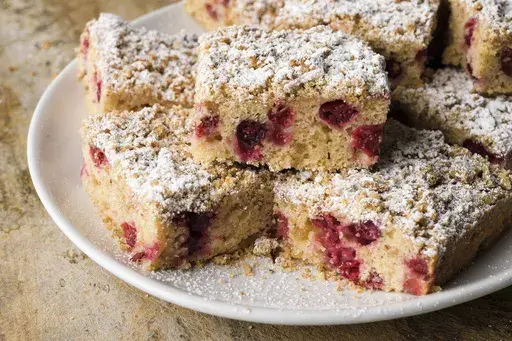 This image released by Milk Street shows a recipe for cranberry and candied ginger buckle. (Milk Street via AP)