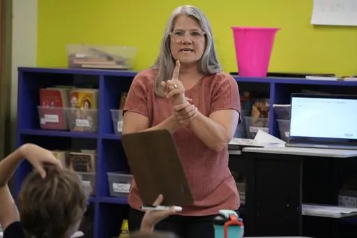 Elementary math teacher Margie Howells teaches a fifth grade class at Wheeling Country Day School in Wheeling, W.Va., on Tuesday, Sept. 5, 2023. Howells said that she turned to the science of math after wondering why there weren't as many resources for dyscalculia as there were for dyslexia. (AP Photo/Gene J. Puskar)