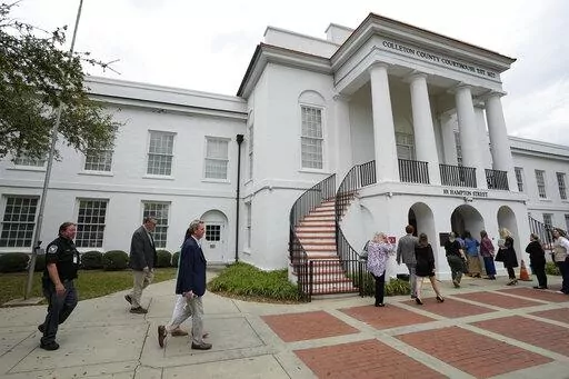 Members of the media and general public gathered outside the Colleton County Courthouse Thursday, March 2, 2023, in Walterboro, S.C. As the double murder trial of Alex Murdaugh wraps, the heaps of public attention poured on the case's many twists and turns. The 54-year-old attorney is standing trial on two counts of murder in the shootings of his wife and son at their Colleton County home and hunting lodge on June 7, 2021. (AP Photo/Chris Carlson)