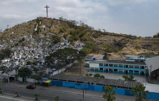 The campus of the Fiscal Duran School sits empty in Duran, the sister city of Guayaquil, Ecuador, Friday, Sept. 29, 2023. The Ministry of Education temporarily closed the physical campuses of some schools in Duran starting in October and required the students and faculty to teach and learn remotely, in response to high crime. (AP Photo/Rodrigo Abd)