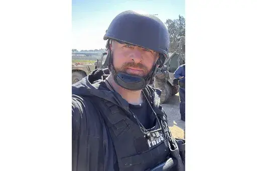 Reuters safety adviser Ryan Evans takes a selfie while working with a news reporting team near the border with Gaza in Be'eri, southern Israel, Feb. 8, 2024. (Ryan Evans/Reuters via AP)
