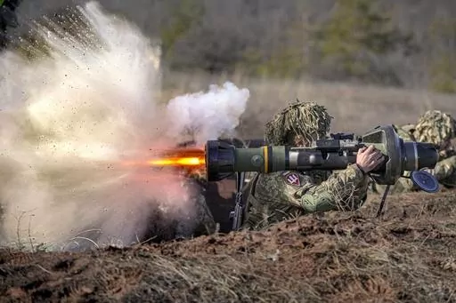 A Ukrainian serviceman fires an NLAW anti-tank weapon during an exercise in the Joint Forces Operation, in the Donetsk region, eastern Ukraine, Feb. 15, 2022. An independent watchdog says many Western arms companies failed to ramp up production in 2022 despite a strong increase in demand for weapons and military equipment. Labor shortages, soaring costs and supply chain disruptions were exacerbated by Russia’s invasion of Ukraine, according to the Stockholm International Peace Research Institu